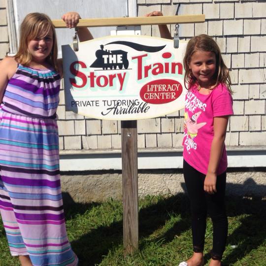 The Story Train Literacy Center logo